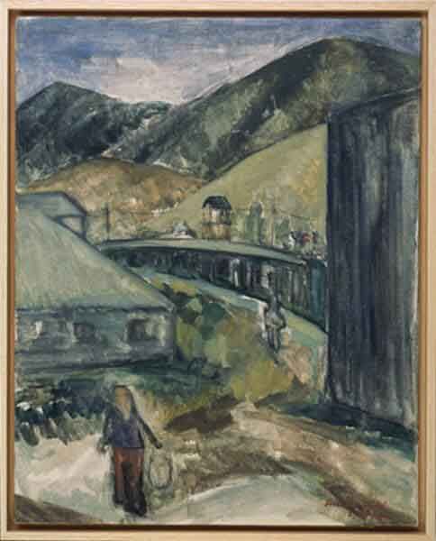 A painting entitled "Barrack 9" by Hisako Hibi. The canvas is framed with a modest wooden frame. It depicts a lone figure against a backdrop of grey barracks, with green hills in the background.